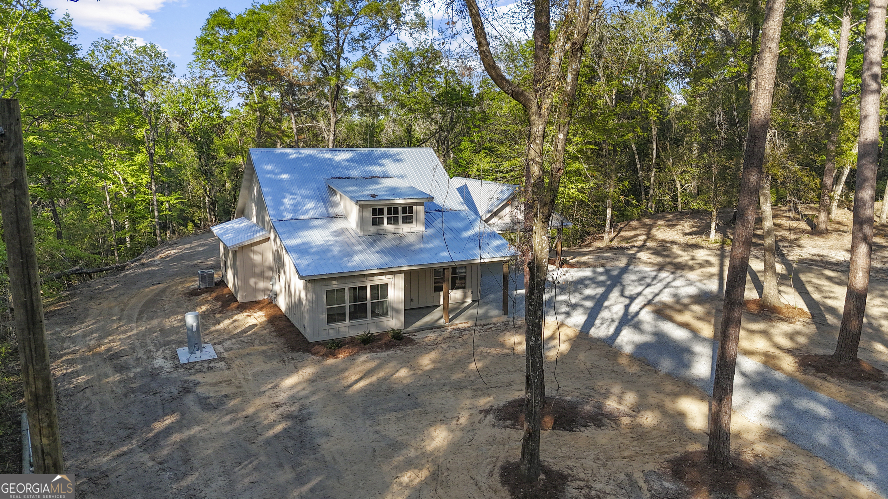 150 Lakeview Drive Jesup, GA 31545 - Photo 2 of 34 a view of a chairs and table on the wooden deck