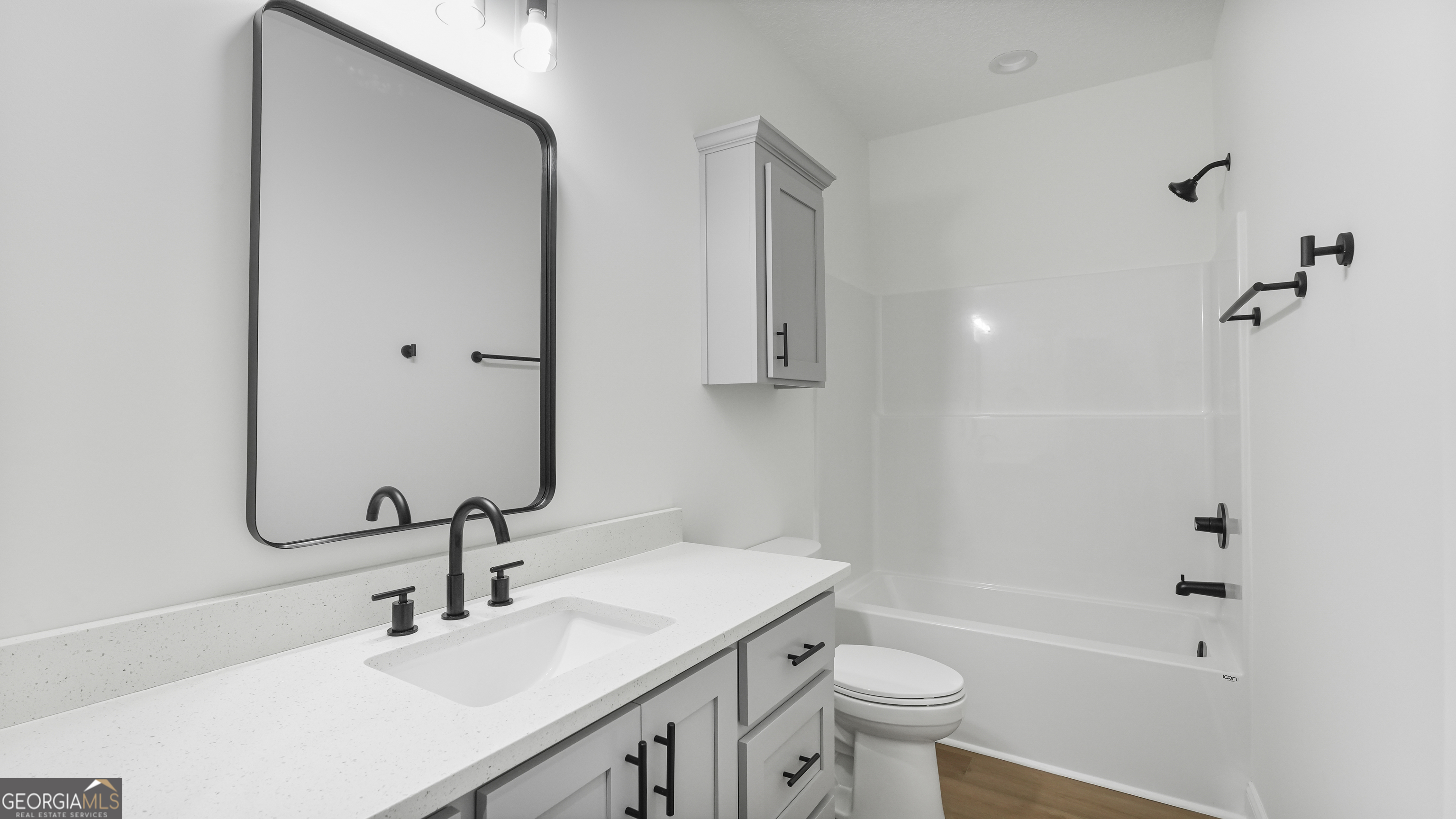 150 Lakeview Drive Jesup, GA 31545 - Photo 29 of 34 a bathroom with a sink a toilet and shower