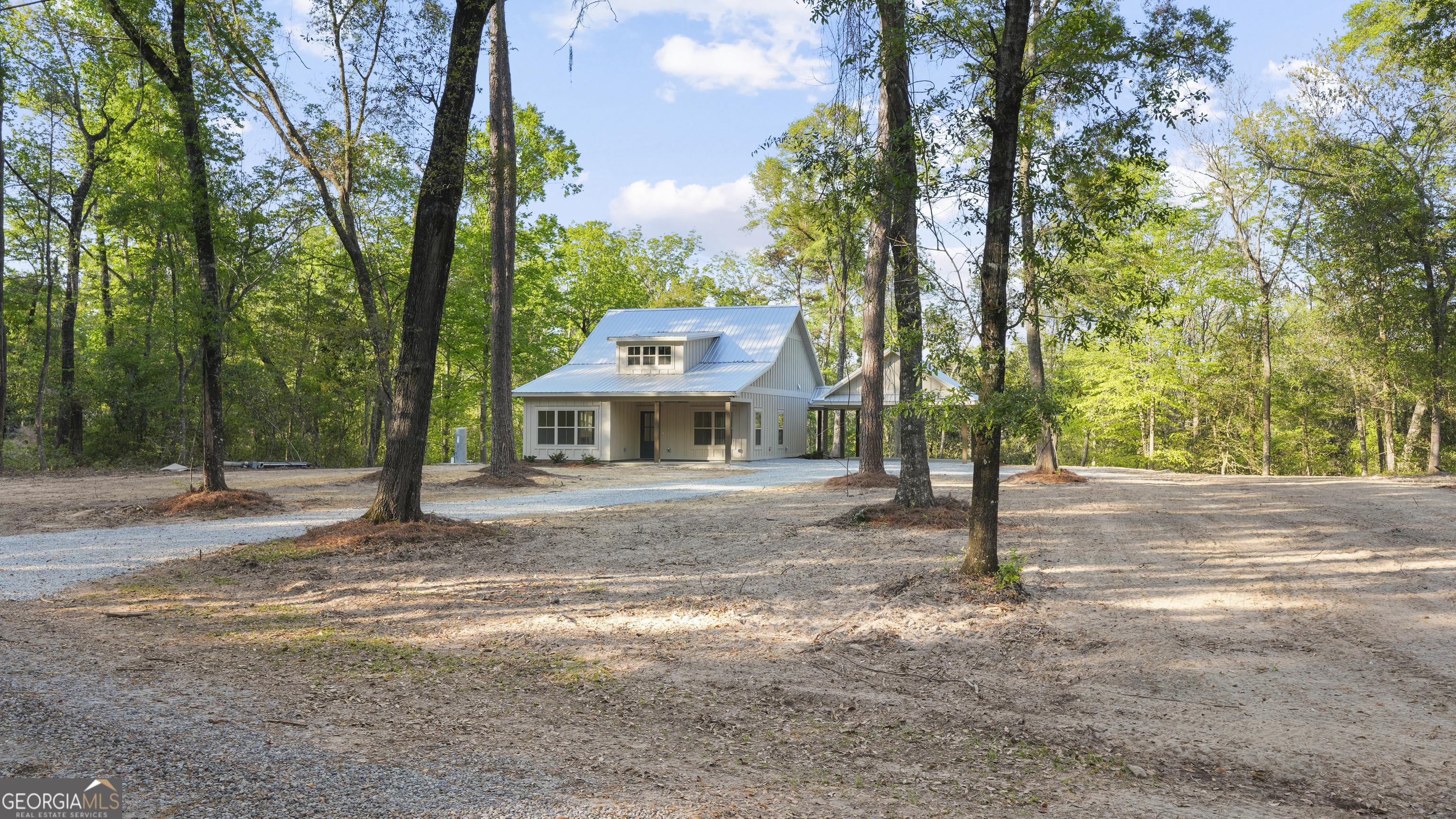 150 Lakeview Drive Jesup, GA 31545 - Photo 5 of 34 a front view of a house with a trees
