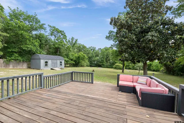 a view of deck with wooden floor and seating space