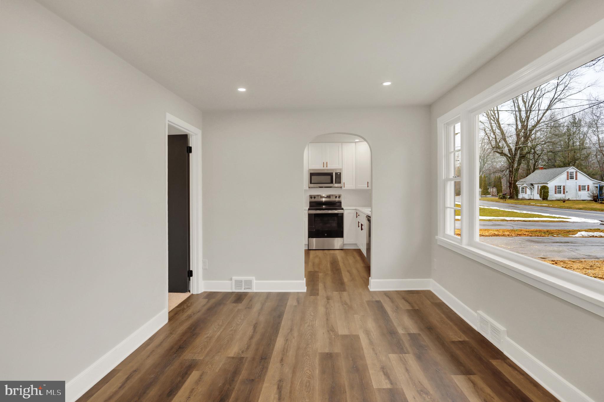 311 Pine Road Mount Holly Springs, PA 17065 - Photo 17 of 44 a view of empty room with wooden floor and fan