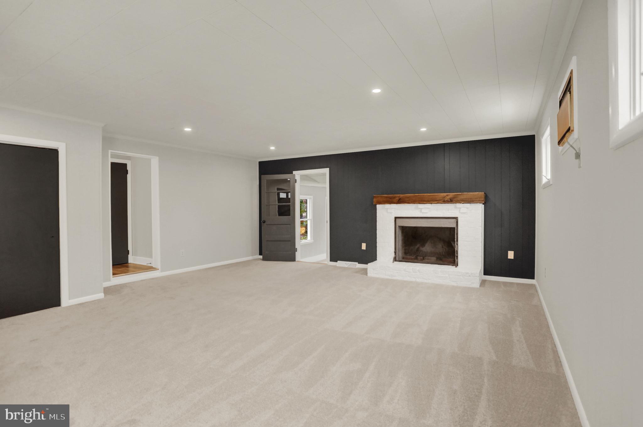 311 Pine Road Mount Holly Springs, PA 17065 - Photo 4 of 44 a view of an empty room with a fireplace and a fireplace