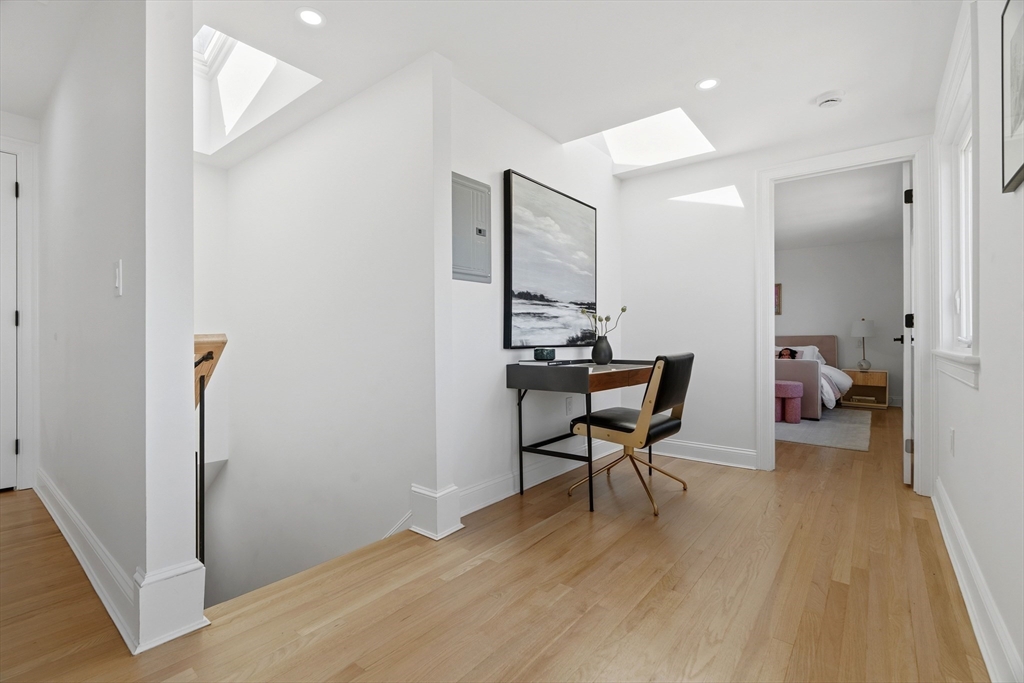 171 Shaw Road Brookline, MA 02467 - Photo 24 of 42 a living room with furniture and a table