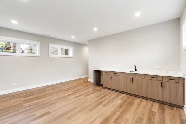 a view of a kitchen with wooden floor