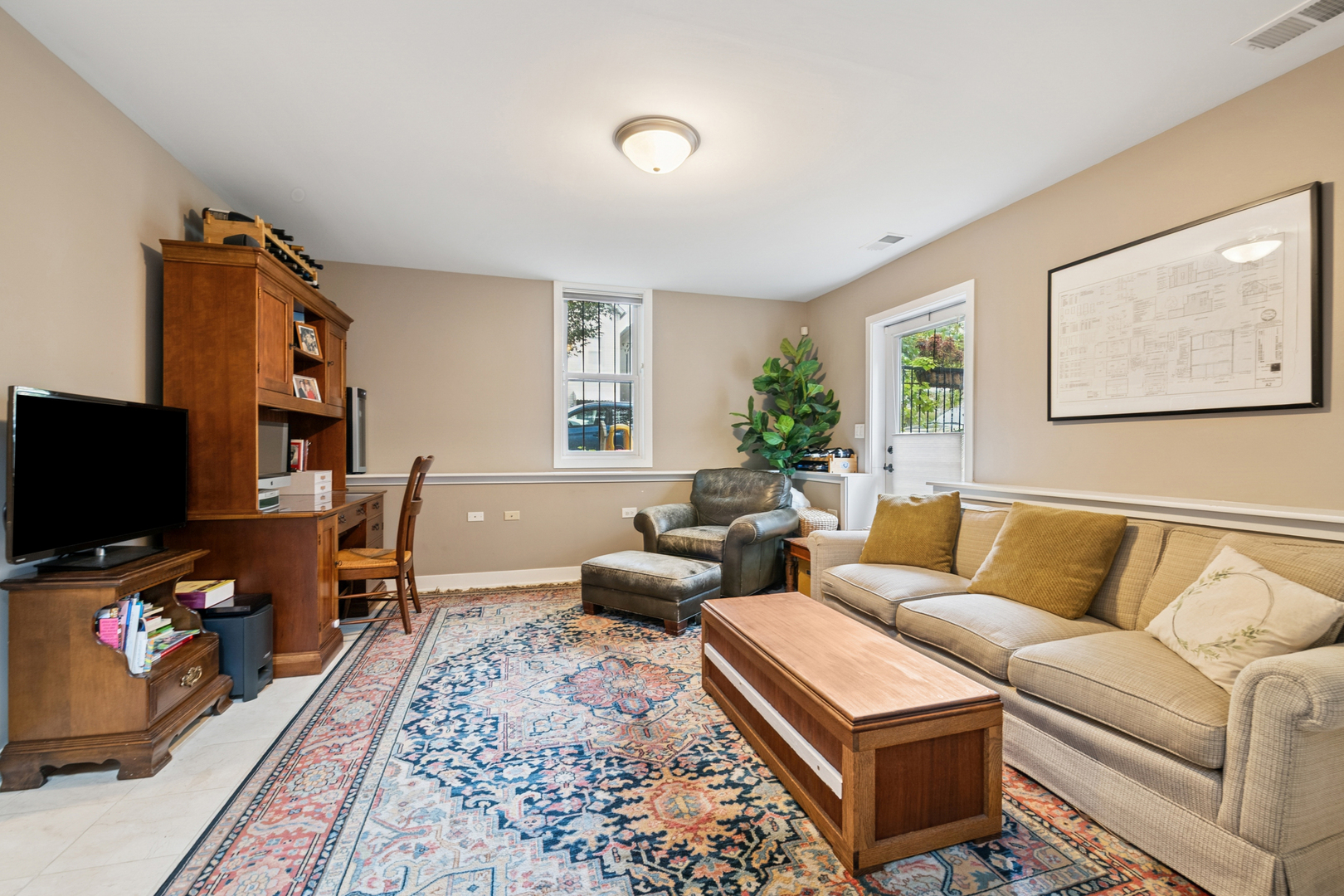 1809 West Melrose Street Chicago, IL 60657 - Photo 17 of 25 a living room with furniture and a flat screen tv