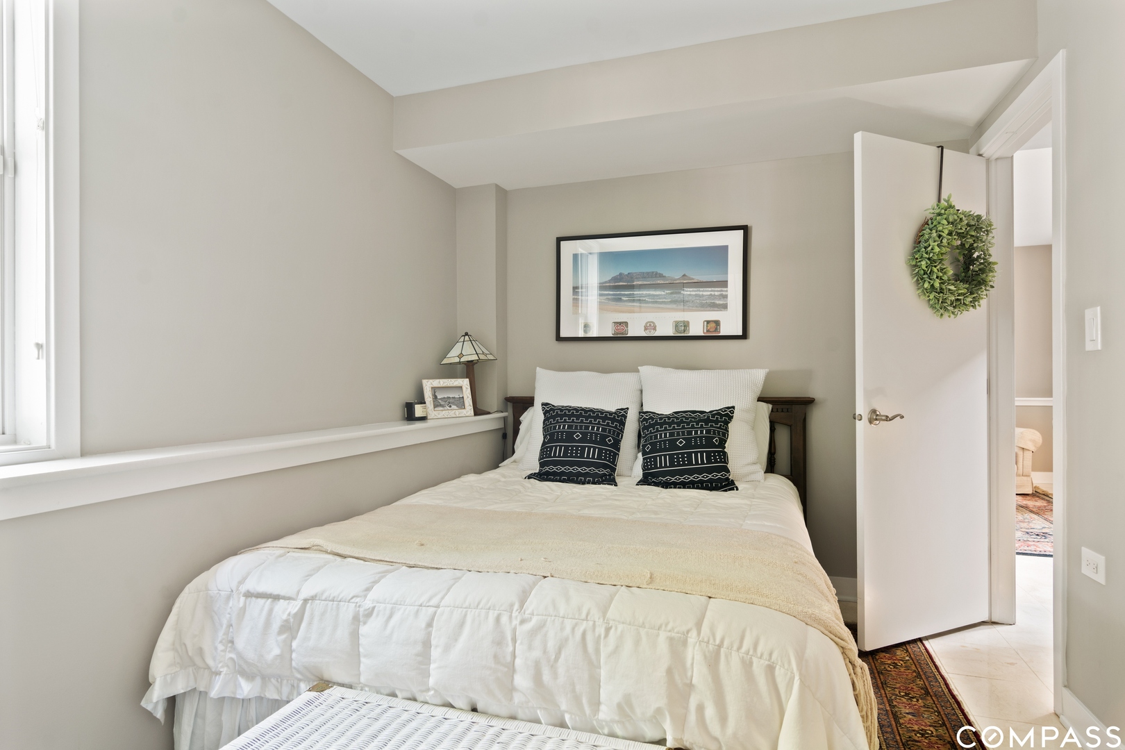 1809 West Melrose Street Chicago, IL 60657 - Photo 19 of 25 a bedroom with a bed and a window