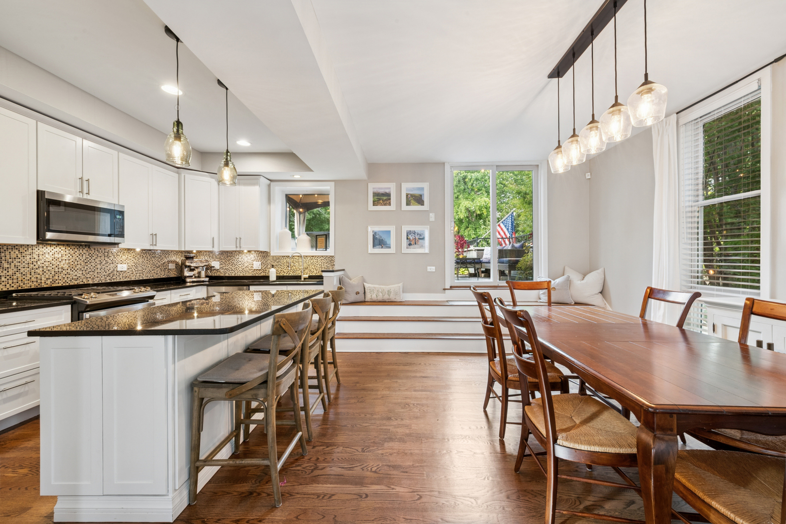 1809 West Melrose Street Chicago, IL 60657 - Photo 7 of 25 a kitchen with sink a center island and stainless steel appliances