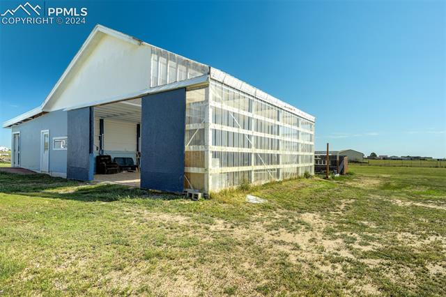 5845 Peerless Farms Road Peyton, CO 80831 - Photo 41 of 50 View of outbuilding with a yard