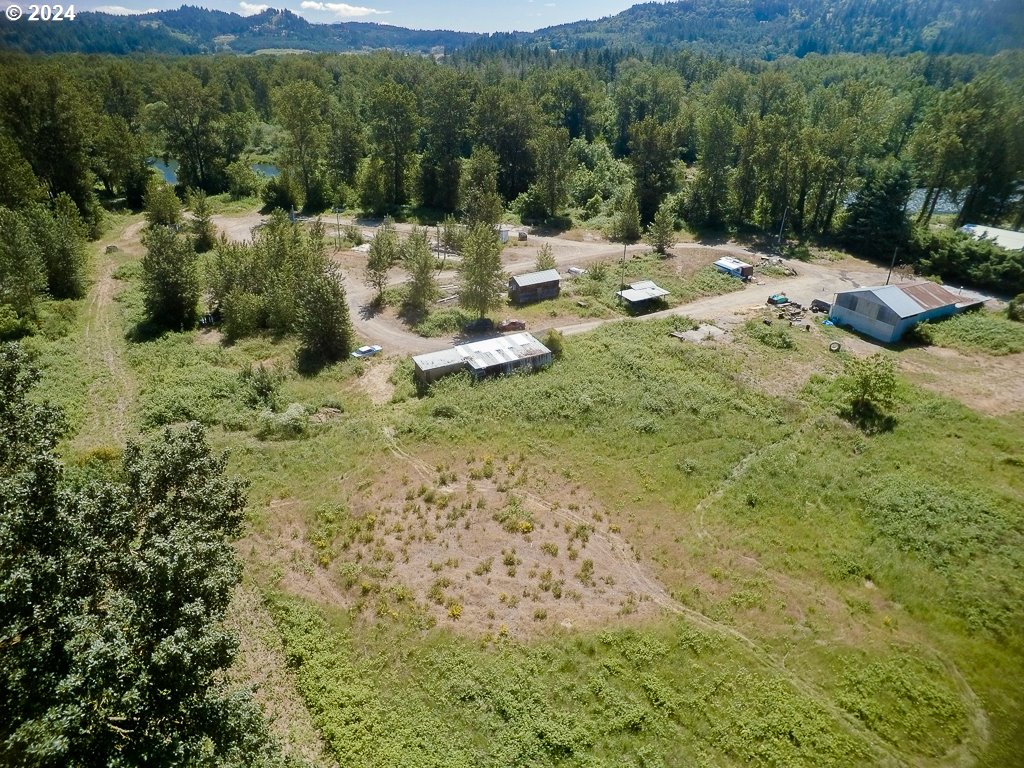 33065 Tennessee Road Southeast, Unit 2 Lebanon, OR 97355 - Photo 2 of 10 a view of a yard with a table and chairs
