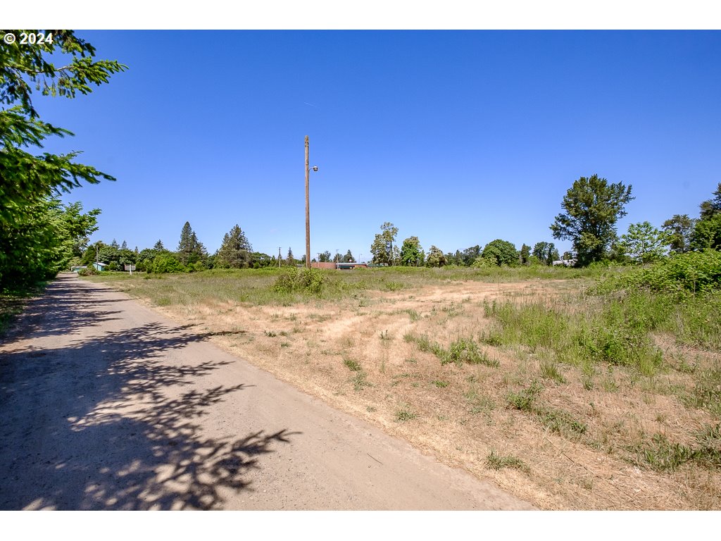 33065 Tennessee Road Southeast, Unit 2 Lebanon, OR 97355 - Photo 8 of 10 a view of a lake with a house in the background