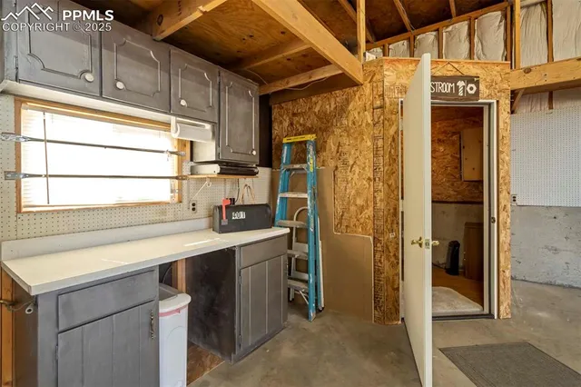 a view of a kitchen with a sink and dishwasher