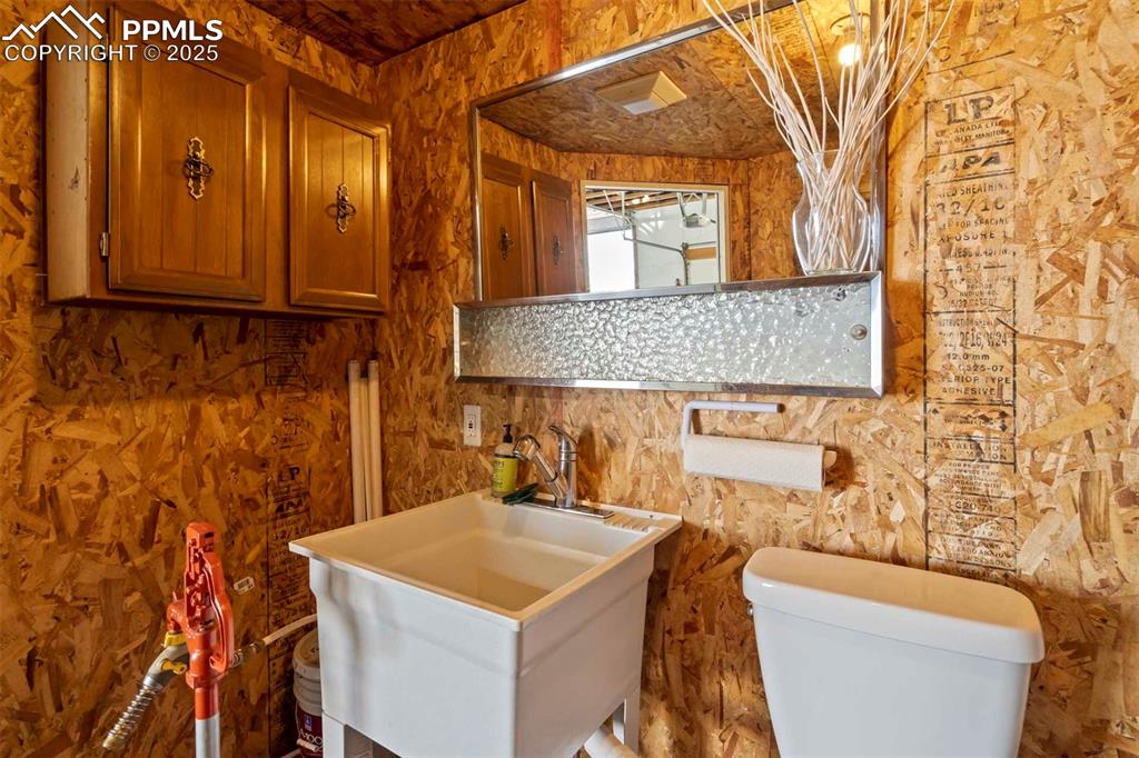 401 Cheyenne Street Calhan, CO 80808 - Photo 17 of 34 a bathroom with a sink and a mirror
