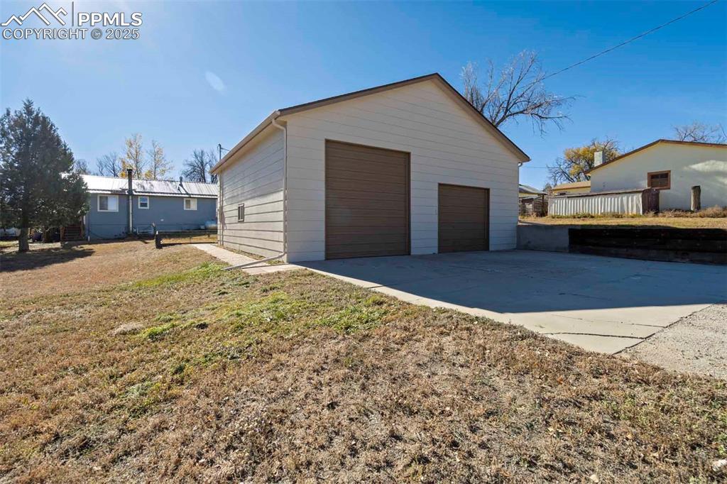 401 Cheyenne Street Calhan, CO 80808 - Photo 33 of 34 a view of a house with a yard