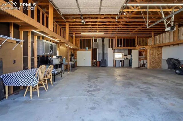 a view of a building with a couple of chairs and a table