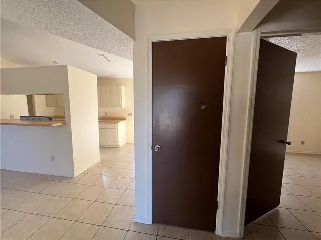 a view of a kitchen from the hallway