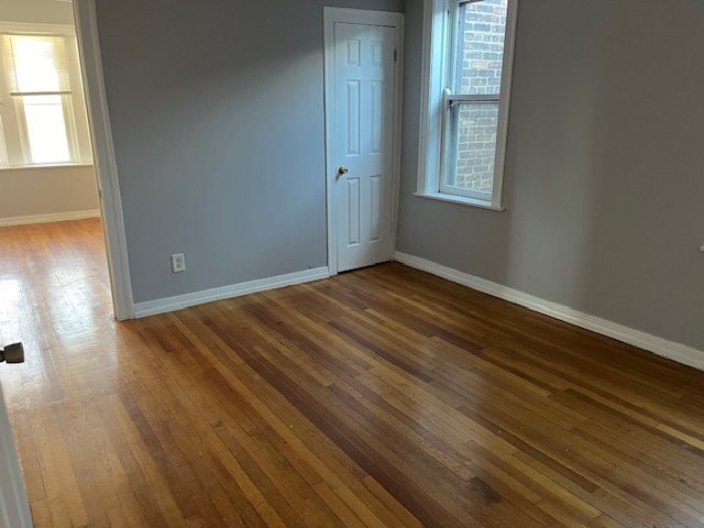 7804 South Burnham Avenue, Unit 2 Chicago, IL 60649 - Photo 7 of 9 a view of an empty room and window