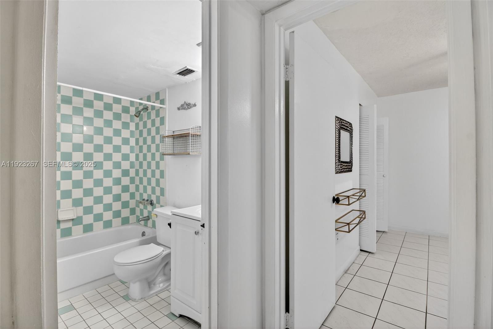 11309 Southwest 200th Street, Unit 209C Miami, FL 33157 - Photo 15 of 28 a bathroom with a toilet and a shower
