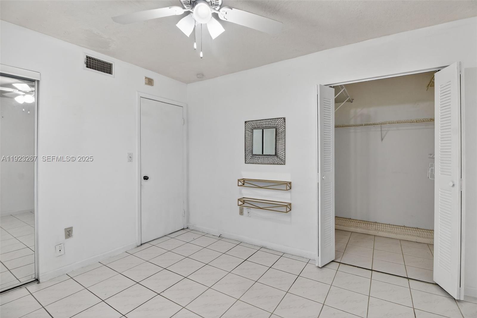 11309 Southwest 200th Street, Unit 209C Miami, FL 33157 - Photo 17 of 28 a view of a livingroom with an empty space