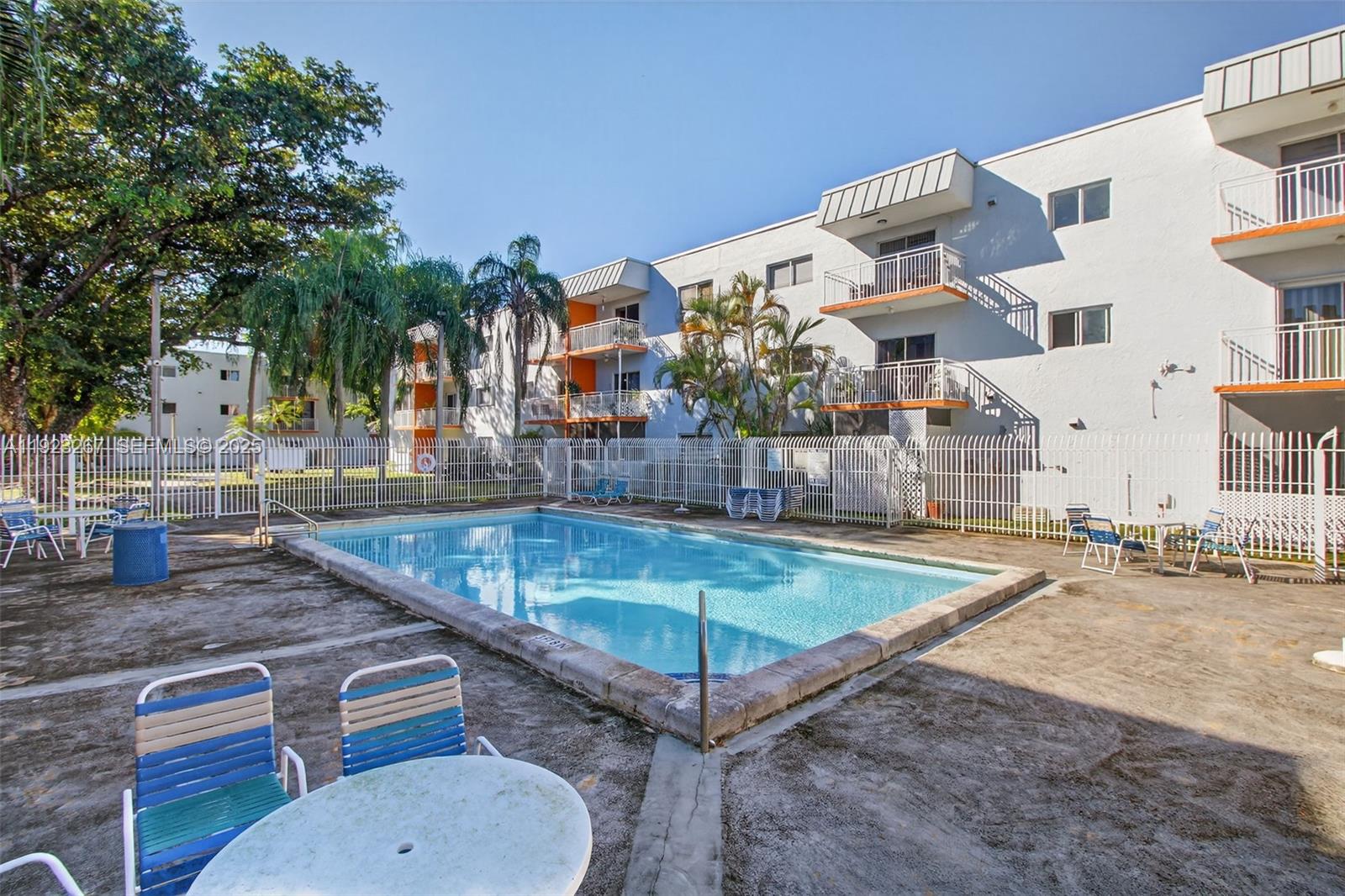 11309 Southwest 200th Street, Unit 209C Miami, FL 33157 - Photo 25 of 28 a view of a patio with swimming pool