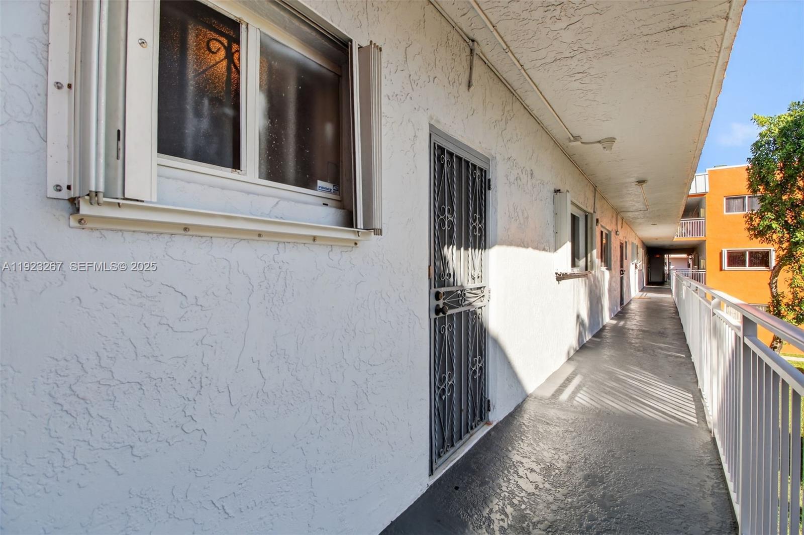 11309 Southwest 200th Street, Unit 209C Miami, FL 33157 - Photo 26 of 28 a view of a house with a balcony