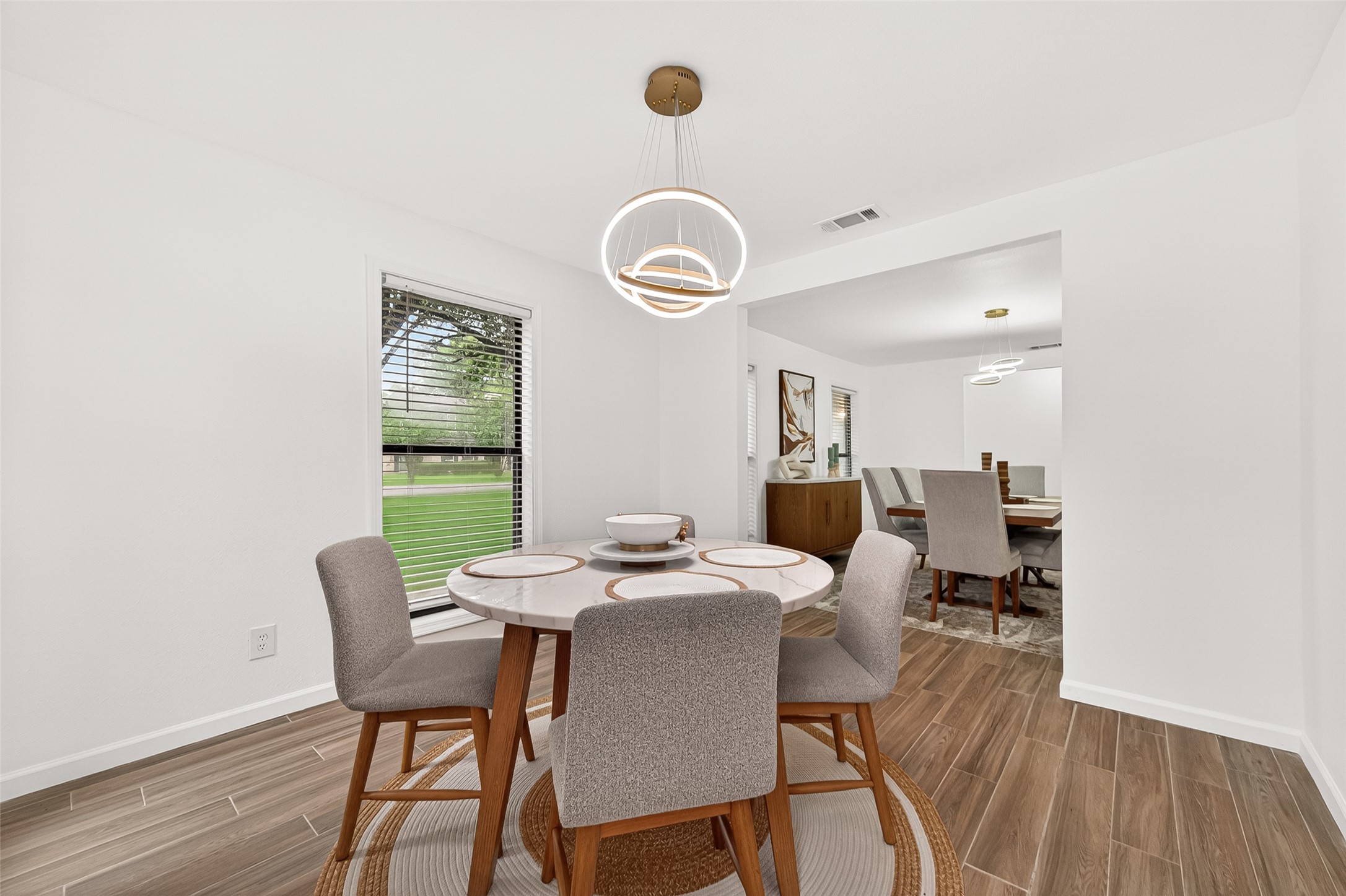 548 Brandon Road Conroe, TX 77302 - Photo 10 of 37 Cozy breakfast nook with seating for four-perfect for casual dining and morning coffee.