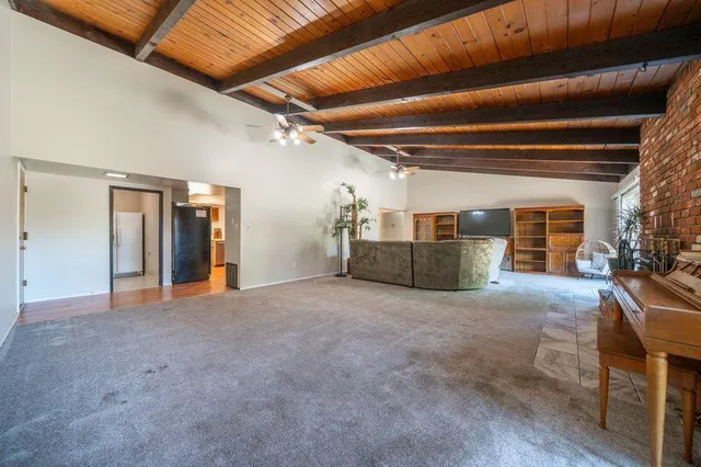 a view of walk in closet with clothes