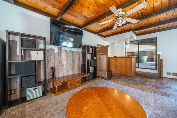 a kitchen with cabinets appliances a sink and a window