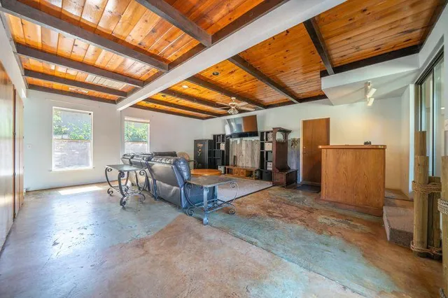 a kitchen with a stove sink and window