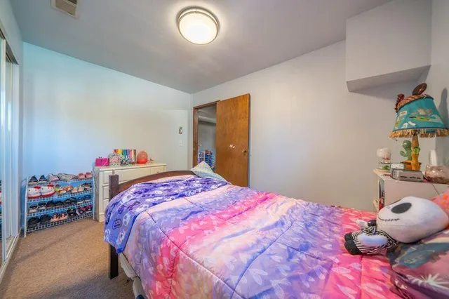 an aerial view of a house with a yard and lake view