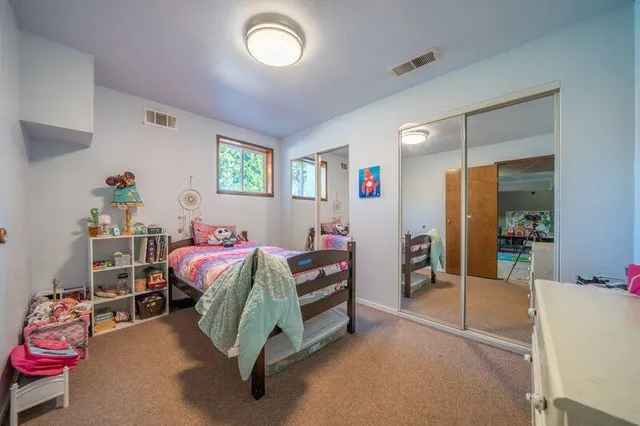 a view of a lake with houses in the back