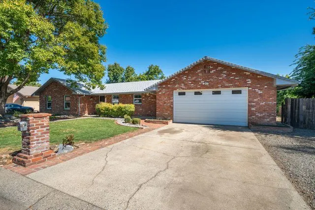 a view of a lake with houses in the back