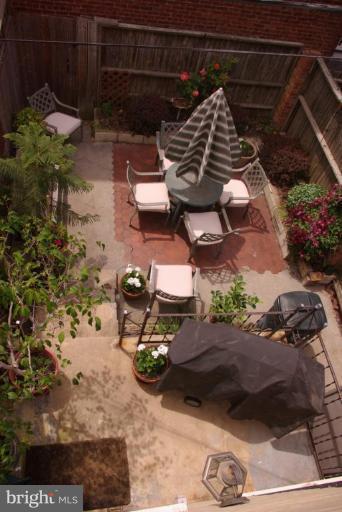 340 10th Street Northeast Washington, DC 20002 - Photo 15 of 19 Pleasant rear patio w/planting beds