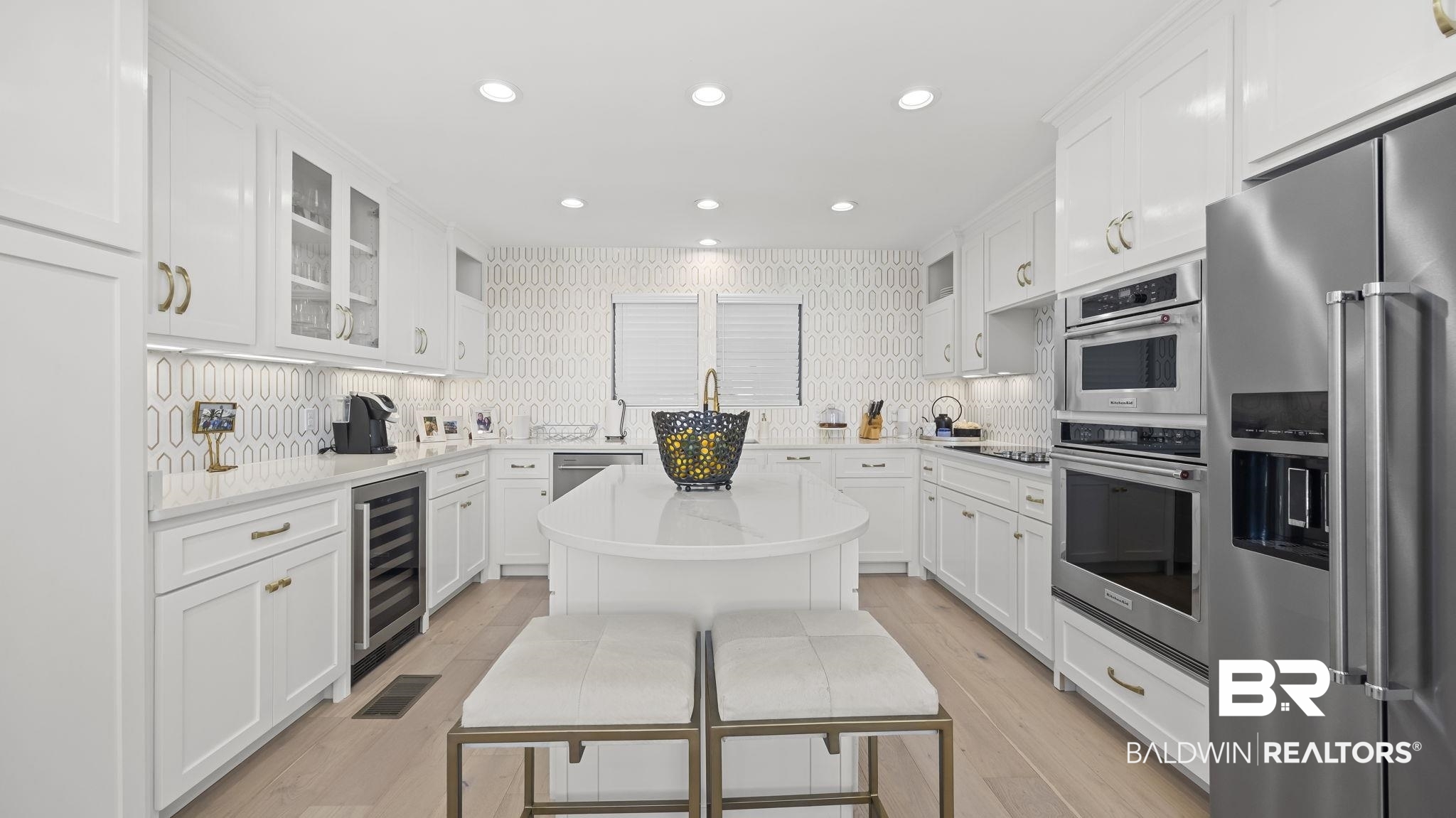 30194 River Road Orange Beach, AL 36561 - Photo 7 of 45 Kitchen featuring stainless steel appliances, white cabinetry, glass insert cabinets, and recessed lighting