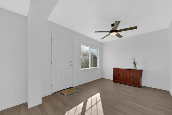 a view of room and wooden floor