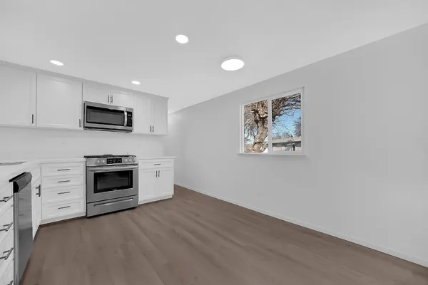 a view of a livingroom with an empty space and a fireplace