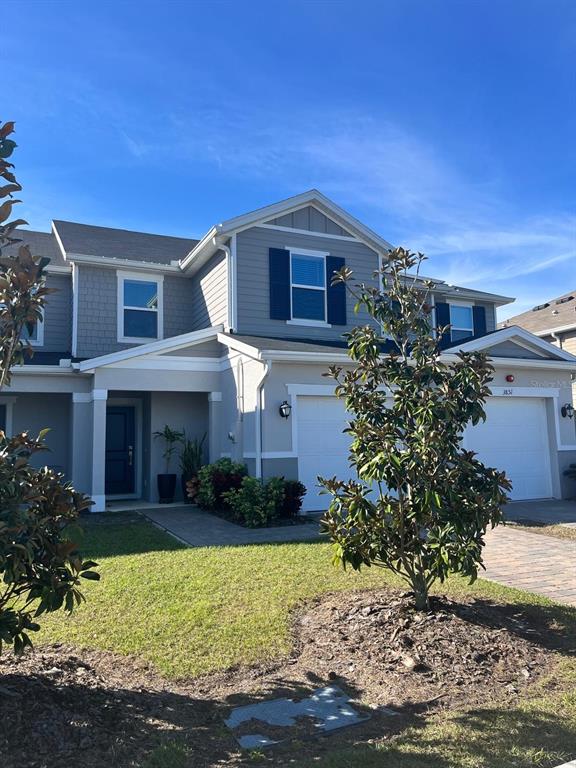 a front view of a house with a yard