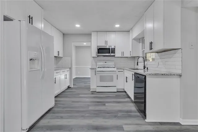 $399,000 | 5618 Fern Creek Drive Southwest, Lilburn, GA 30047