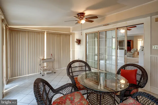 a view of a livingroom with furniture and a window