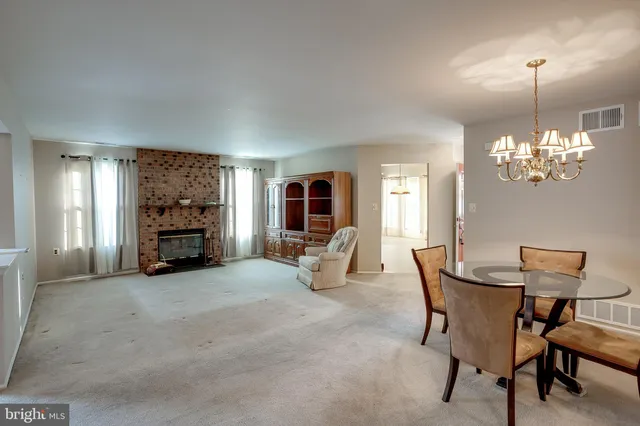 a view of a livingroom with furniture and a chandelier