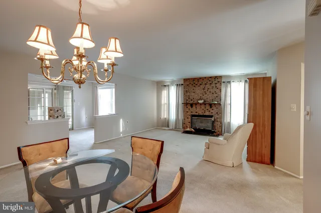 a view of a livingroom with furniture window and fireplace
