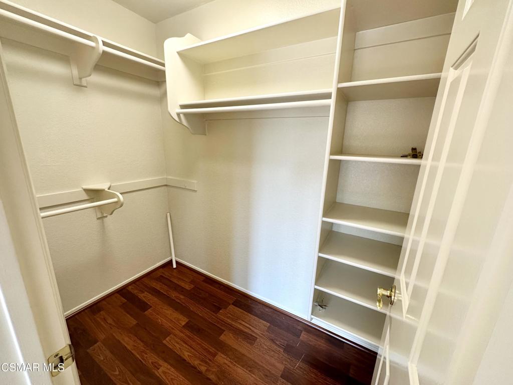 672 Indian Oak Lane, Unit 103 Oak Park, CA 91377 - Photo 16 of 34 a view of walk in closet with empty racks