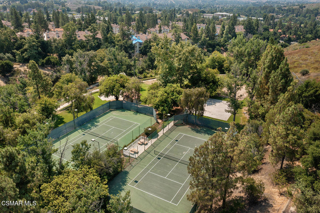 672 Indian Oak Lane, Unit 103 Oak Park, CA 91377 - Photo 27 of 34 an aerial view of a house with a yard
