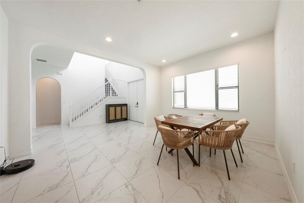 11843 Southwest 13th Court Pembroke Pines, FL 33025 - Photo 12 of 37 a dining room with furniture and window