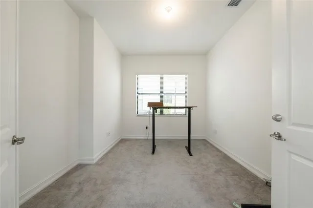 a view of a hallway with front door