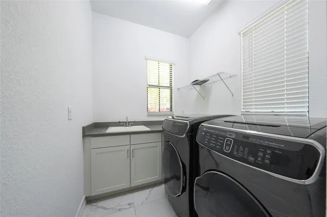 a utility room with dryer and washer