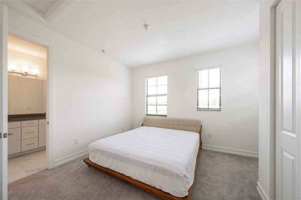 11843 Southwest 13th Court Pembroke Pines, FL 33025 - Photo 18 of 37 a bedroom with a bed and a window