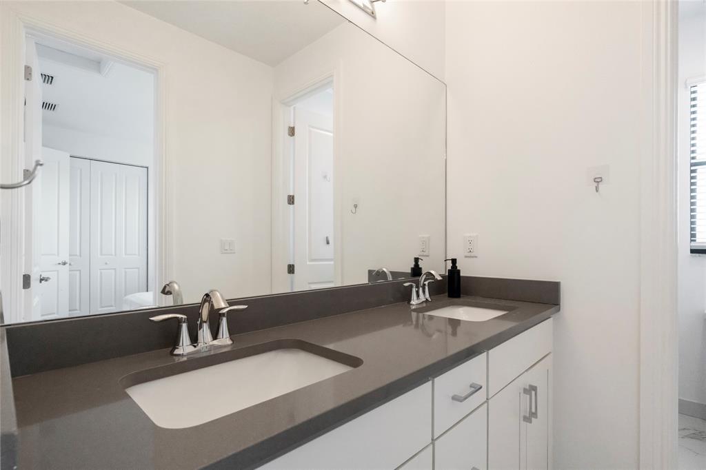 11843 Southwest 13th Court Pembroke Pines, FL 33025 - Photo 19 of 37 a bathroom with a sink and a mirror