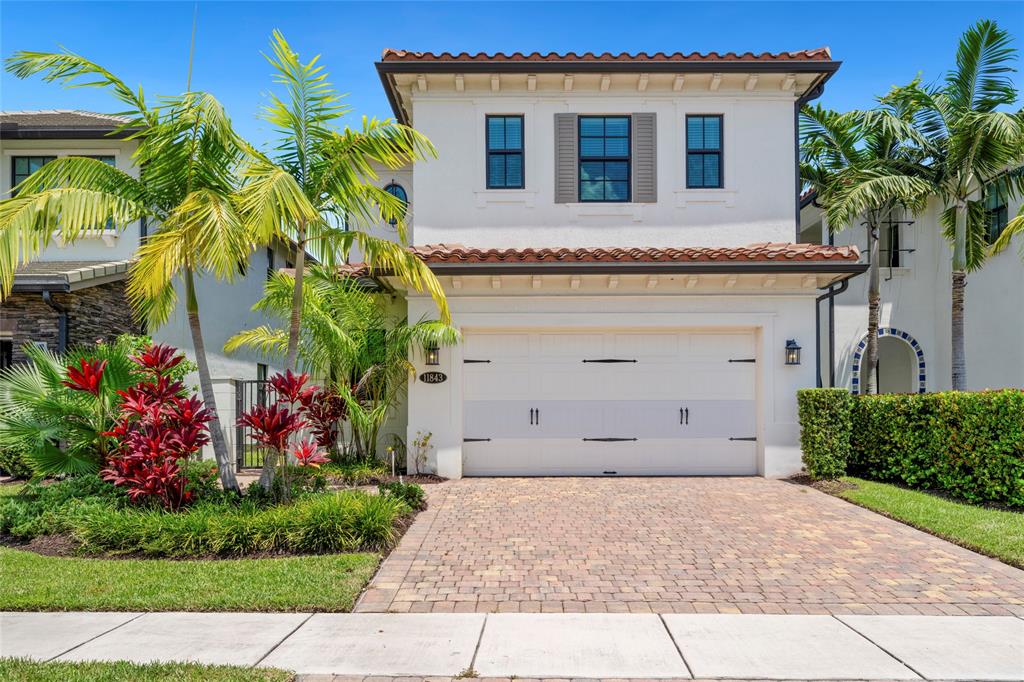 11843 Southwest 13th Court Pembroke Pines, FL 33025 - Photo 2 of 37 a view of a house with a yard and potted plants