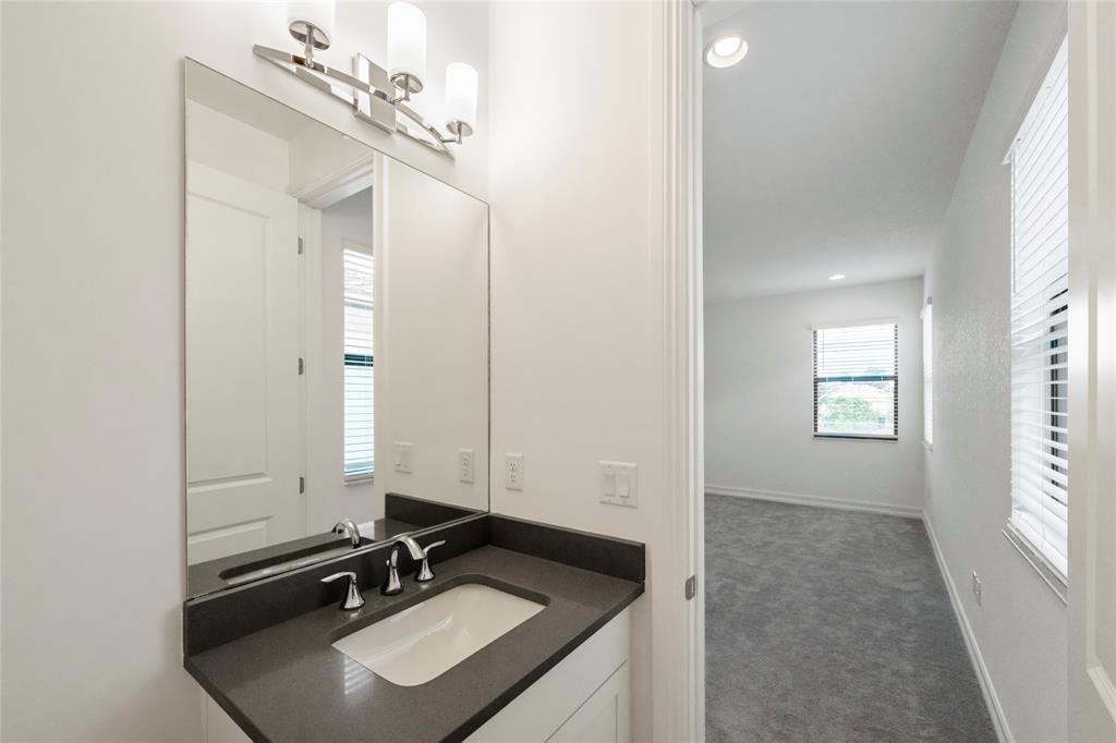 11843 Southwest 13th Court Pembroke Pines, FL 33025 - Photo 23 of 37 a bathroom with a sink vanity granite and a mirror