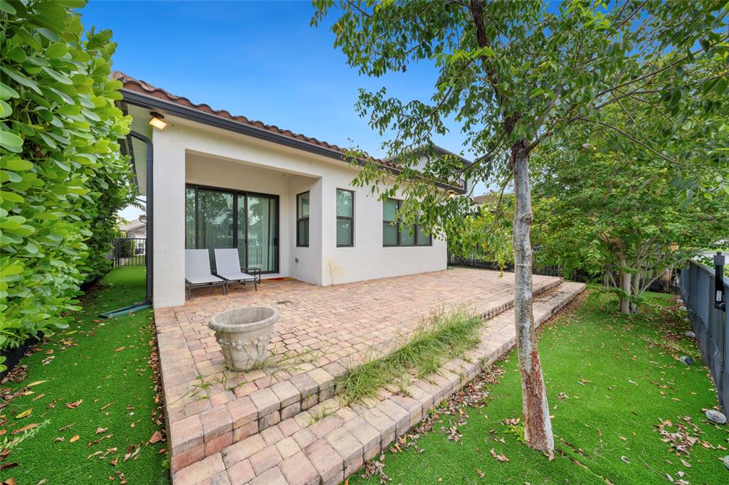 11843 Southwest 13th Court Pembroke Pines, FL 33025 - Photo 25 of 37 a view of a house with backyard and sitting area